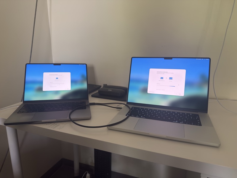 A 14-inch MacBook Pro M1-Pro connected to a brand new 16-inch MacBook Pro M5-Max using a Thunderbolt 4 cable