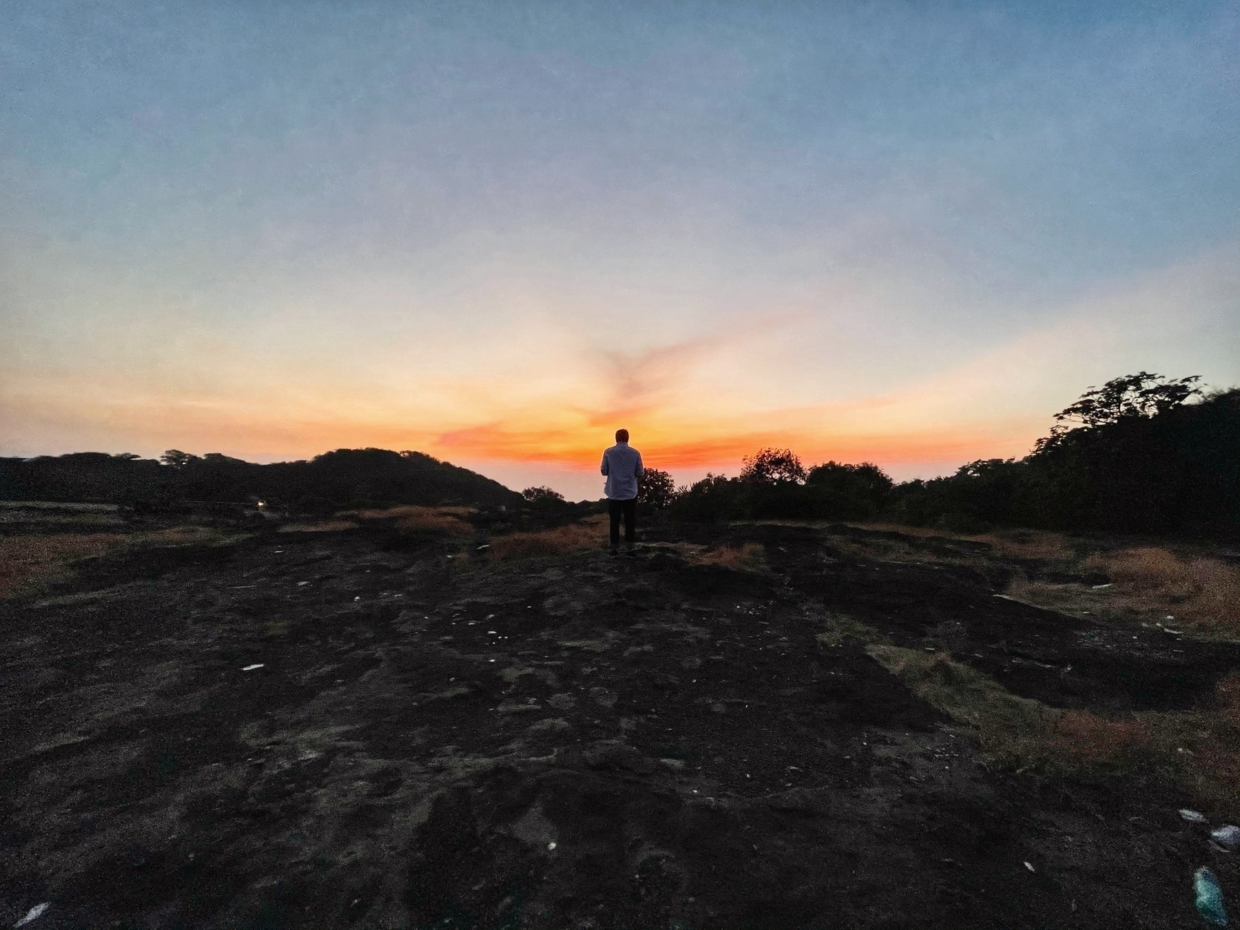 Brother's silhouette against the setting sun.